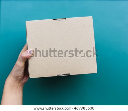 Hand holding a box