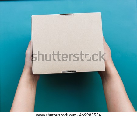 Hand holding a box