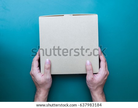 Hand holding a box