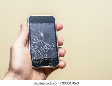 Hand Holding Broken Phone