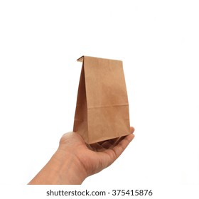 Hand Holding A Brown Paper Bag