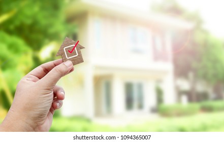 Hand holding brown paper , Home inspection  - Shutterstock ID 1094365007