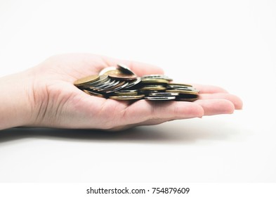 Hand Holding A Bunch Os Coins, Isolated On White. Economic Scenario.