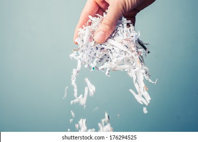 Hand is holding a bunch of shredded paper
