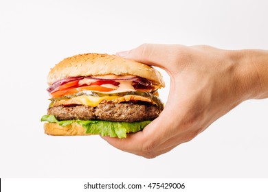 Hand Holding A Burger On White Background. Eating And Healthy Concept
