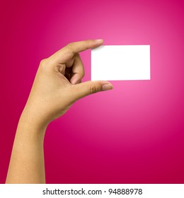 Hand Holding Business Card Against Red Background