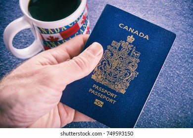 Hand Holding A Canadian Passport