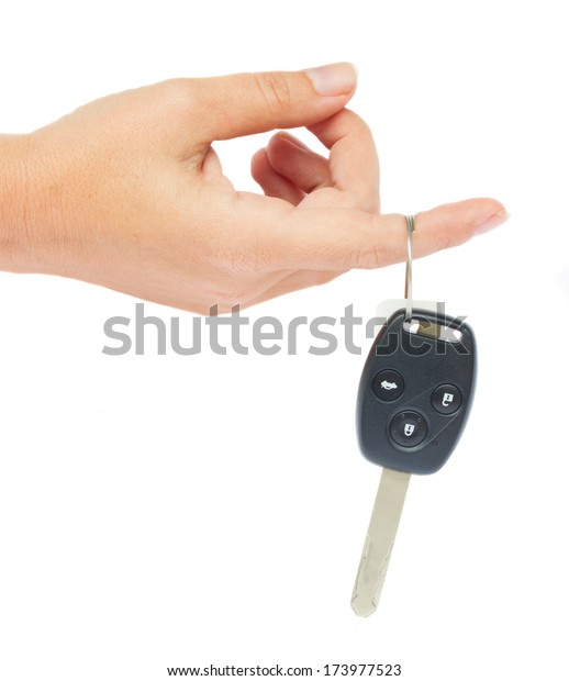 hand\
holding a car key isolated on white\
background