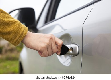 Hand Holding Car Key Unlock The Door