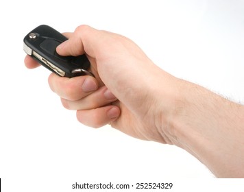 Hand Holding Car Keys Isolated On White Background