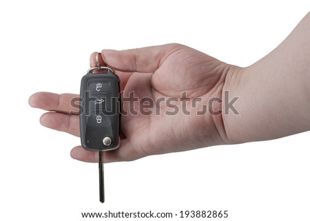 hand holding car keys isolated on white