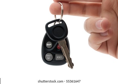 A Hand Holding Car Keys And A Remote Control For Keyless Entry Isolated Over White.