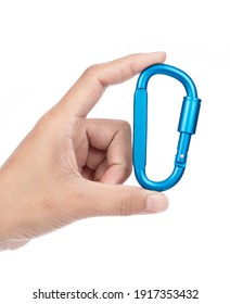 Hand Holding Carabiner Isolated On A White Background.