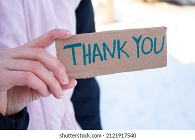 Hand Holding Cardboard Box With Thank You Text. Being Grateful For A Favor Or Help. Woman Say Thank You To Someone.