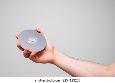 Hand holding a cd disc.