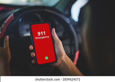 Hand Holding Cell Phone With Emergency Number 911 In Car