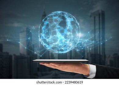 hand holding cellphone with glowing polygonal sphere on blurry night city background. Futuristic technology wireframe mesh polygonal element. Connection Structure. Digital Data Visualization. 