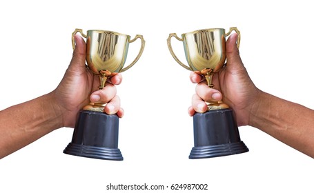 Hand Holding A Champion Golden Trophy Isolated On White.