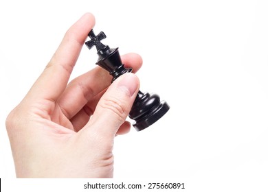 Hand Holding Chess Piece Isolated On White Background