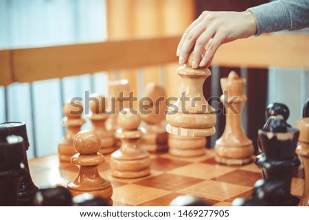 Similar – Image, Stock Photo Boy of primary school age plays chess