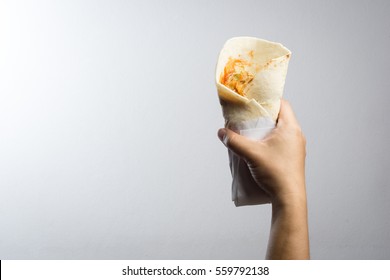 Hand Holding Chicken Kebab On White Background