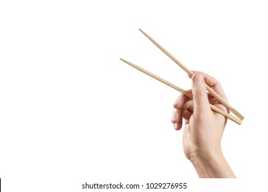 Hand Holding Chinese Traditional Sticks On White Background