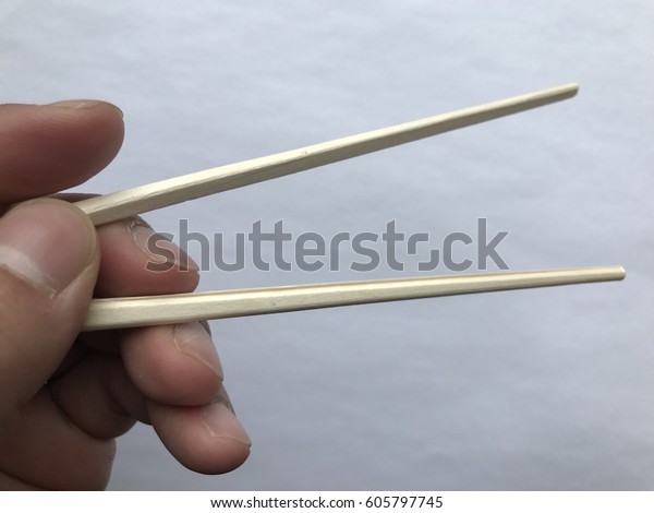 Hand Holding Chopsticks Opening Grab Food Stock Photo Edit Now