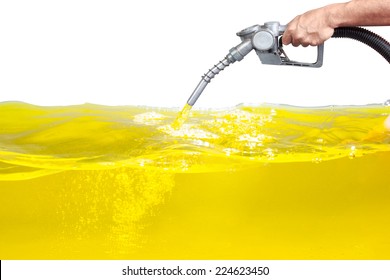 Hand Holding A Classic Fuel Nozzle Pumping A Gasoline Fuel Liquid In A Tank Of Oil Industry Isolated On White Background With Clipping Path