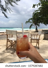 Hand Holding Cocktail, Beach Bar In Caribbean Paradise Barbados 