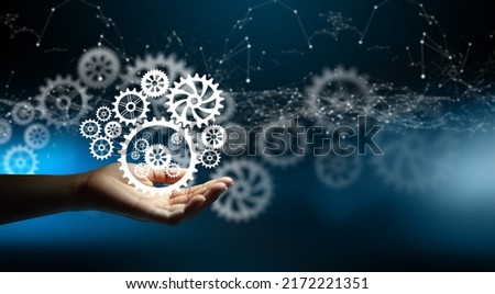 Hand holding cogwheels. Wireframe light connection and Circuit converging point background. Business idea, Teamwork, Planing Strategy, Cooperation, and Analysis solution development Concept.