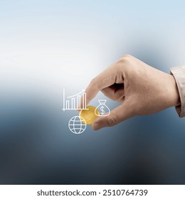 A hand holding a coin with a graph and a dollar sign. Concept of wealth and financial success - Powered by Shutterstock