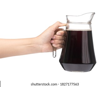 Hand Holding Cola In A Jug With Glass Isolated On A White Background