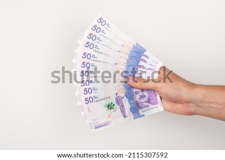 hand holding colombian money 100 - 50 Foto stock © 