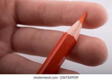 Hand holding color pencil on a white background - Shutterstock ID 2367369939
