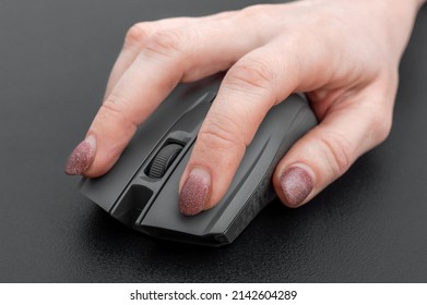 Hand Holding Computer Mouse. Close Up.