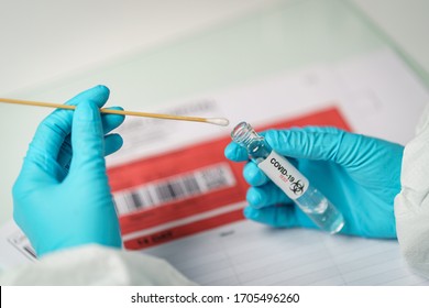 Hand Holding COVID-19 Swab Collection Kit, Specimen Sample Testing Process.