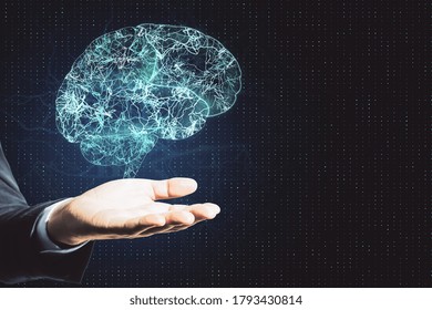 Hand holding creative brain and lines hologram. Artificial intelligence and innovation concept.