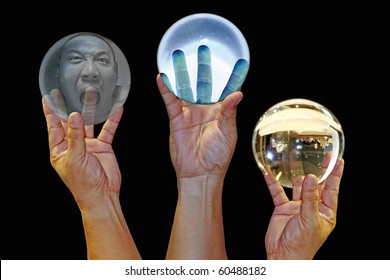 A Hand Holding Crystal Ball With Reflection.