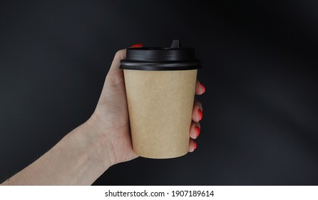 A Hand Holding A Cup Coffee