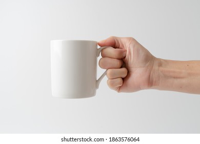 hand holding cup on white background