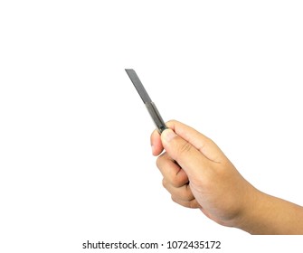 Hand holding a cutter knife and available in cutting. isolated on white background.