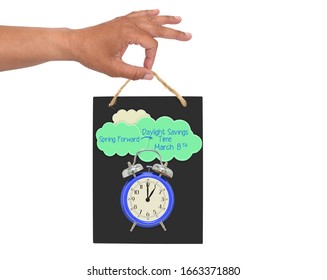 Hand Holding Daylight Savings Time March 8 Clock Blackboard Sign White Background