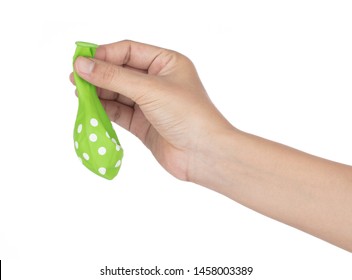 Hand Holding Deflated Balloon Isolated On White Background