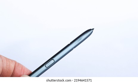 Hand Holding Digital Pen, Android Pen, Stylus, Ipad Stylus, Isolated On White Background. Copy Space.