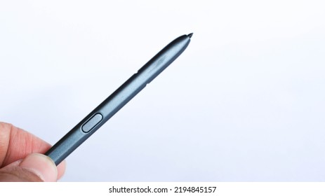 Hand Holding Digital Pen, Android Pen, Stylus, Ipad Stylus, Isolated On White Background. Copy Space.