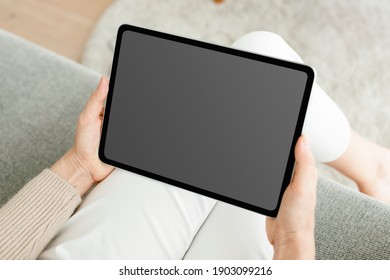 Hand Holding Digital Tablet With Blank Black Screen