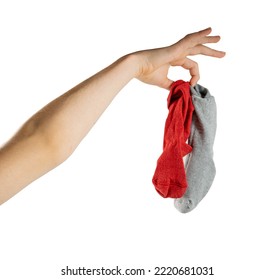 Hand Holding Dirty Socks Isolated. Laundry, Household Chores Concept, Smelly Sock, Sweaty Cotton Underwear, Used Dirty Socks On White Background