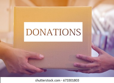 Hand Holding Donation Box For Help.