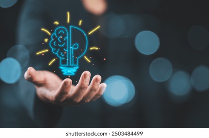 Hand holding drawing virtual lightbulb with brain on bokeh background for creative and smart thinking idea concept. - Powered by Shutterstock