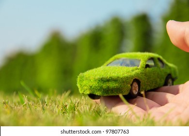 Hand Holding Eco Car Icon Concept